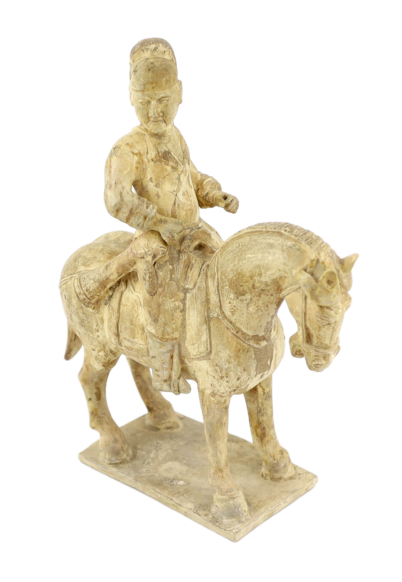 A Chinese cream glazed pottery model of an archer on horseback, Tang Dynasty (618-906 AD)